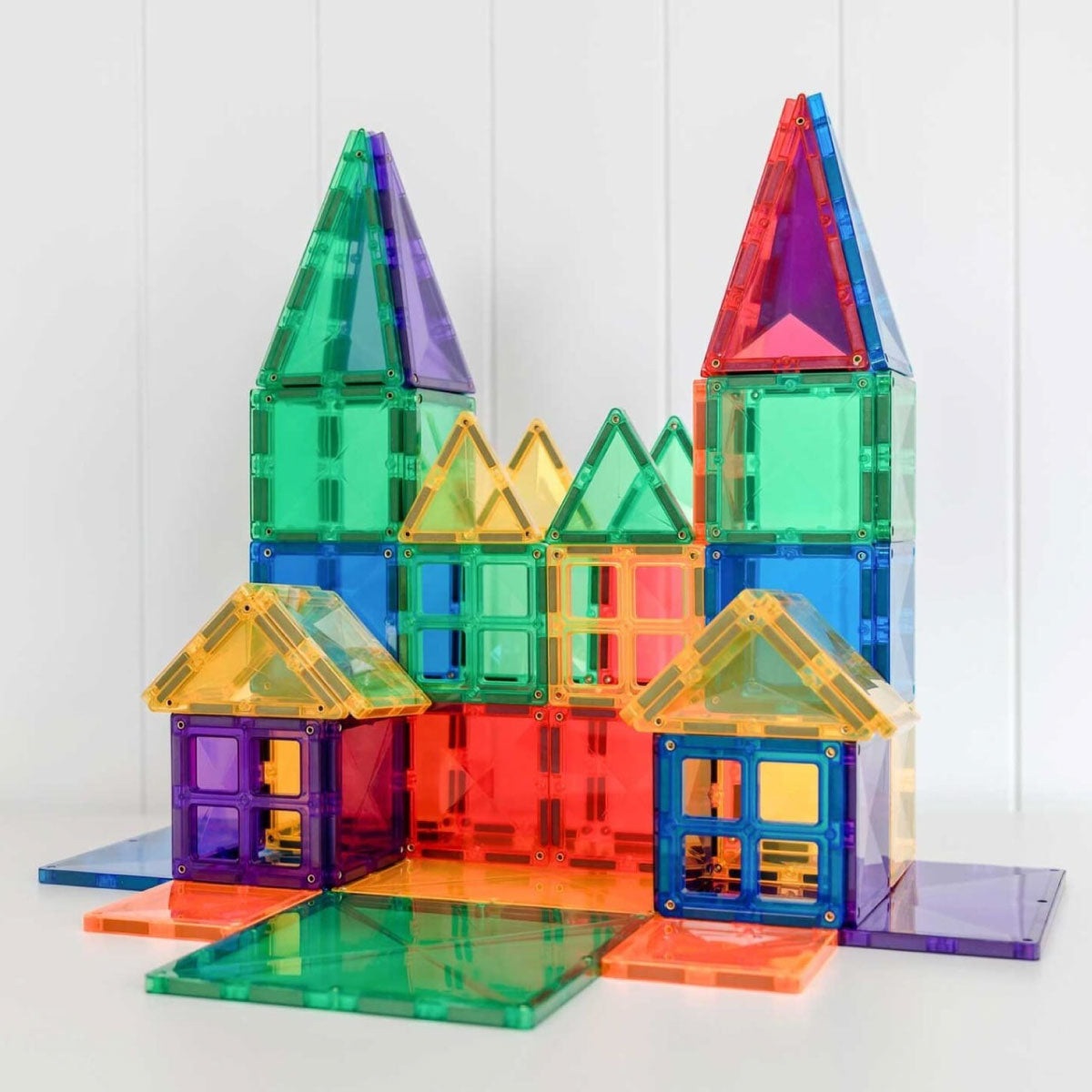 Connetix Rainbow Creative Pack - 102 Piece Set's Colorful magnetic building blocks assembled to create a building with two spires.