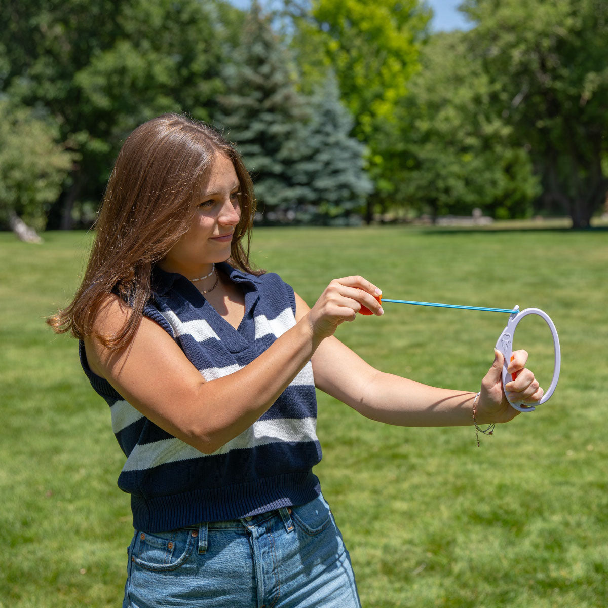 Djubi DartBall How to Play: hook the loop, pull back to launch toward the target net.