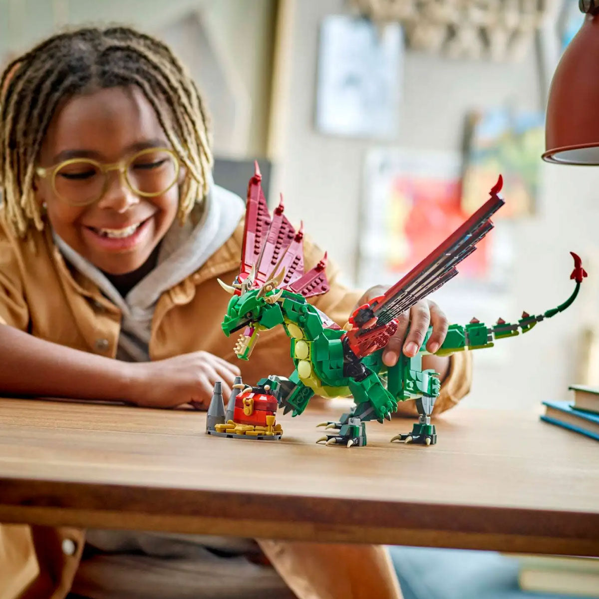 Child playing with LEGO Creator 3 in 1 Medieval Dragon