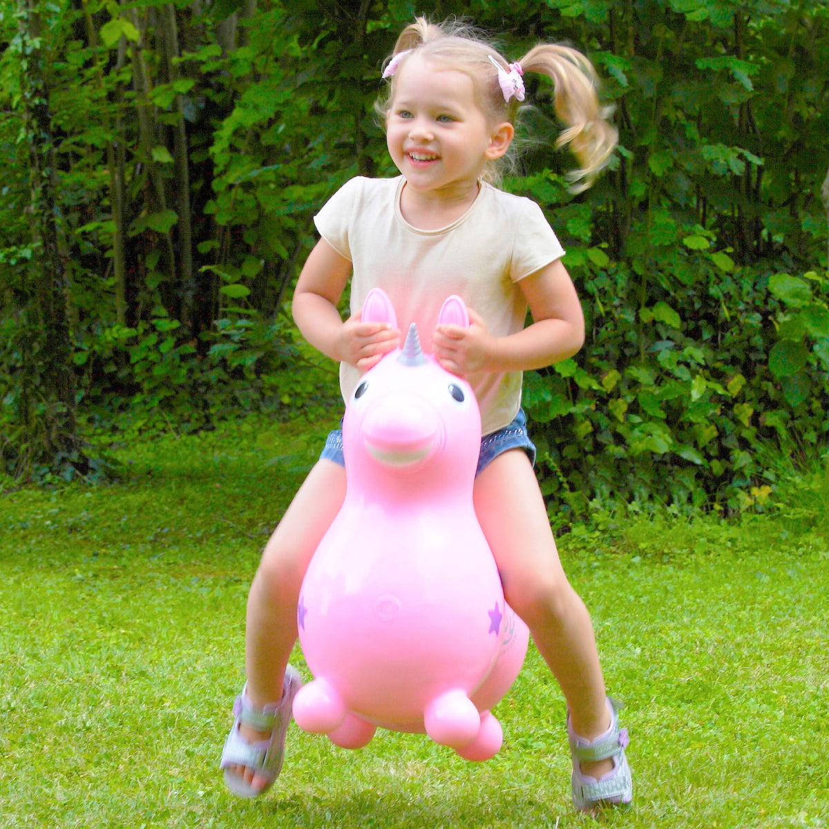 Child riding a Pink Rody Magical Unicorn from Gymnic