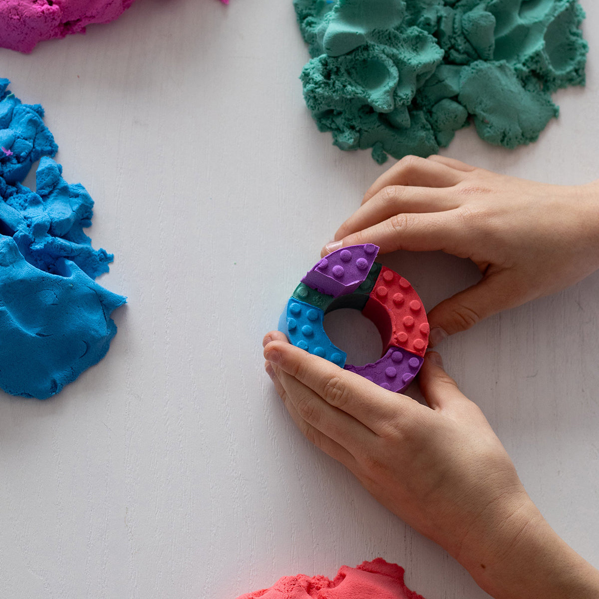 Child building with molded bricks - Mad Mattr Quantum Tool Box 