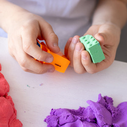 Child building with molded bricks - Mad Mattr Quantum Tool Box 