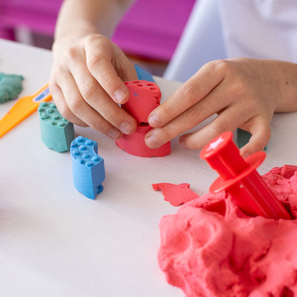 Child building with molded bricks - Mad Mattr Quantum Tool Box 