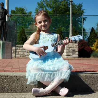 Child Playing the Amahi Blue Glitter Soprano Ukulele