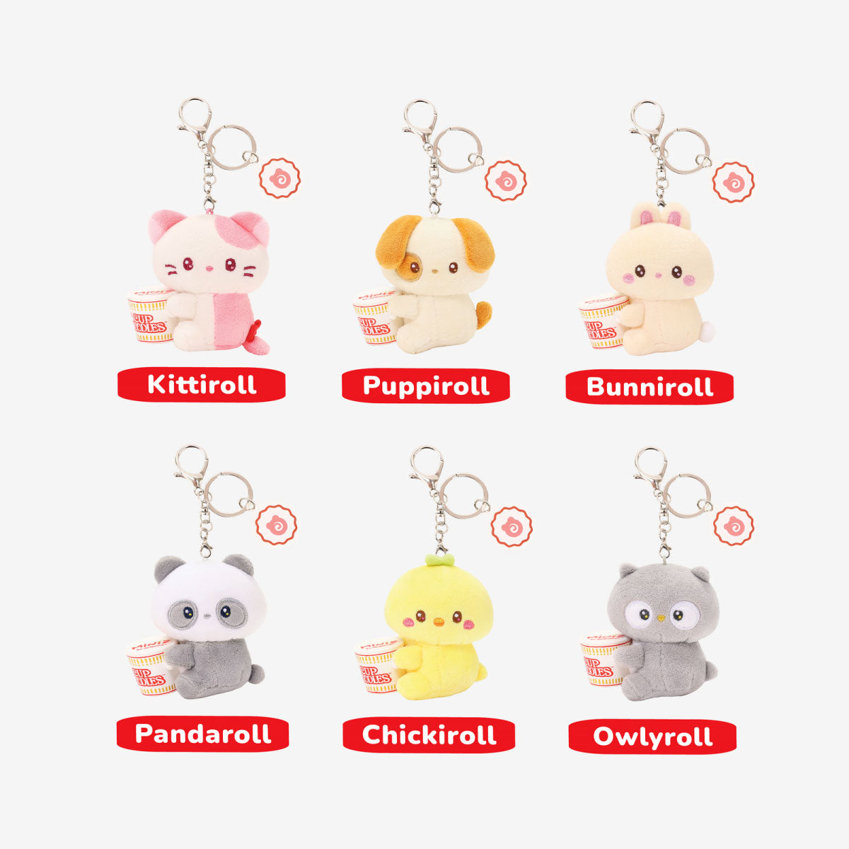 Anirollz Miniz Nissin Cup Noodles Surprise Box Plush Clips plush character keychains arranged in a 2x3 grid on a light gray background, each with a metal key ring and a red label underneath reading the character name: Kittiroll, Pupiroll, Bunniroll, Pandaroll, Chickiroll, and Owlyroll.