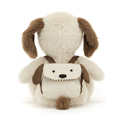 A plush puppy with a puppy backpack by Jellycat.