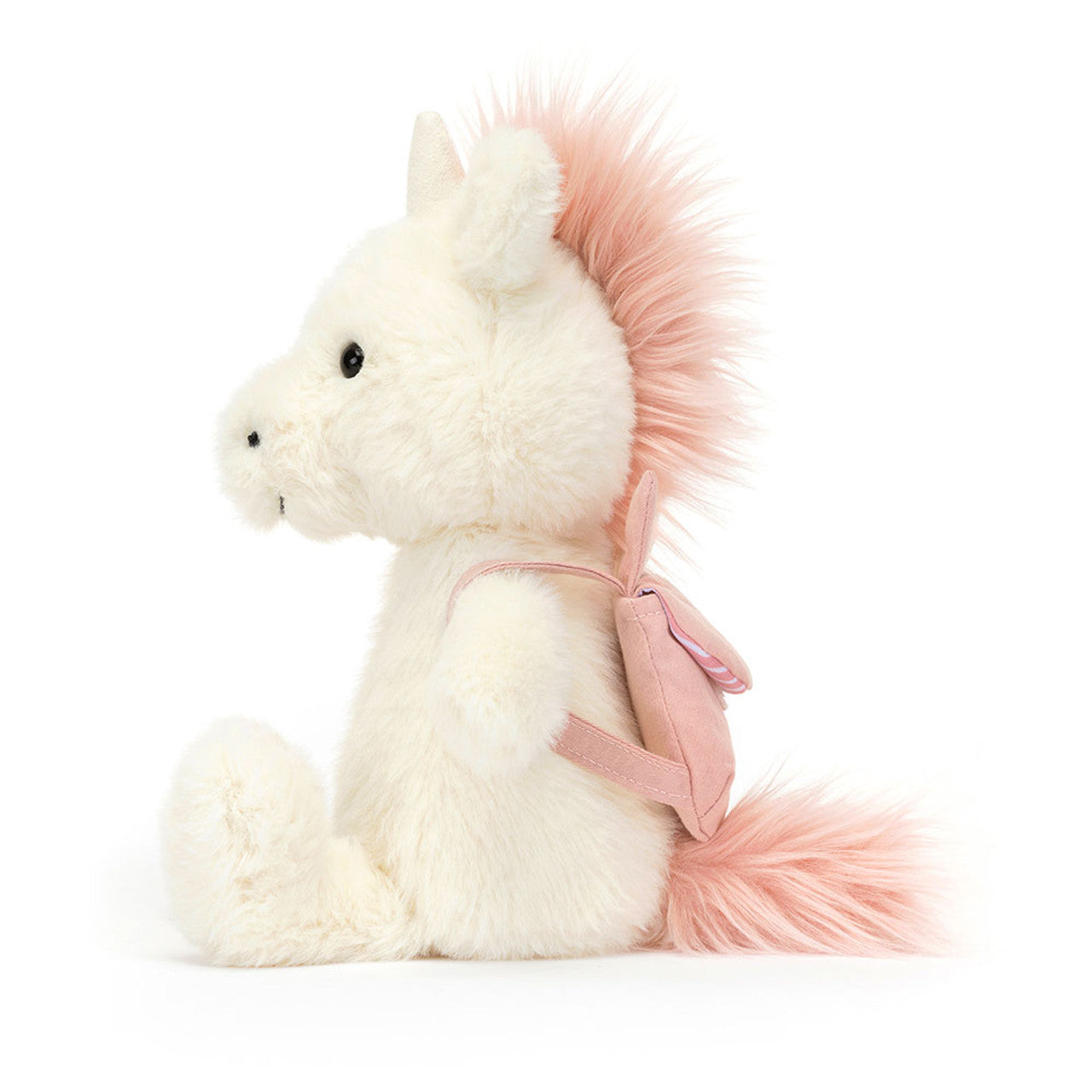 A plush unicorn wearing a pink unicorn backback, by Jellycat.