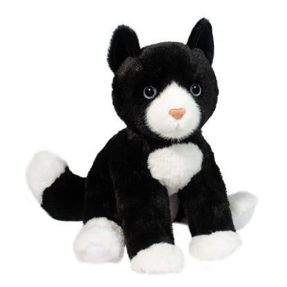 Black and white plush stuffed animal cat facing camera