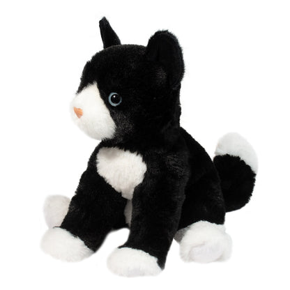 Black and white plush stuffed animal cat facing left