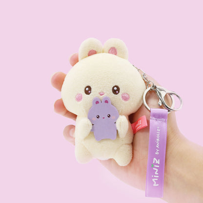 Coosy Anirollz Miniz Mini-Me Bunniroll bag clip in a person's hand.