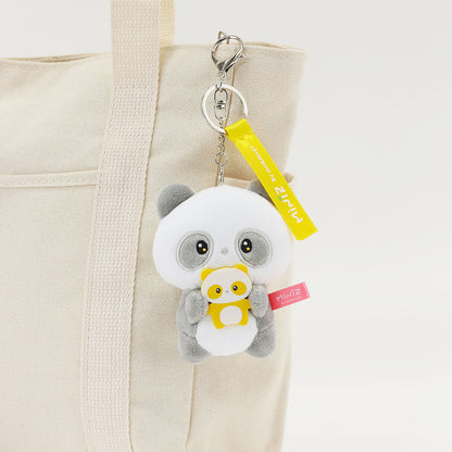 Coosy Anirollz Miniz Mini-Me Pandaroll clipped to a bag.