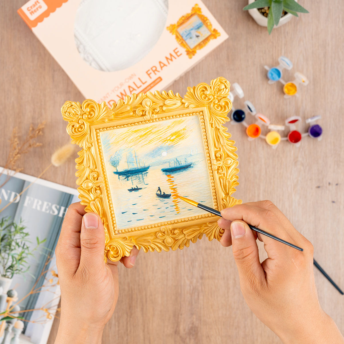 Person painting the Craft Hero Muddies Monet Sunrise 3D Wall Frame Painting Kit