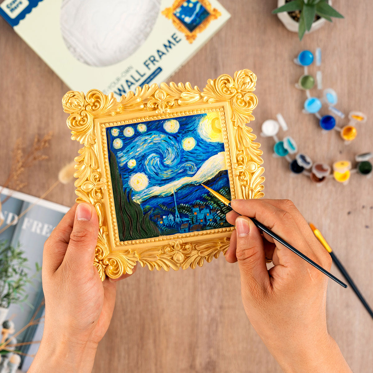 Person painting the Craft Hero Muddies Van Gogh Starry Night 3D Wall Frame Painting Kit 