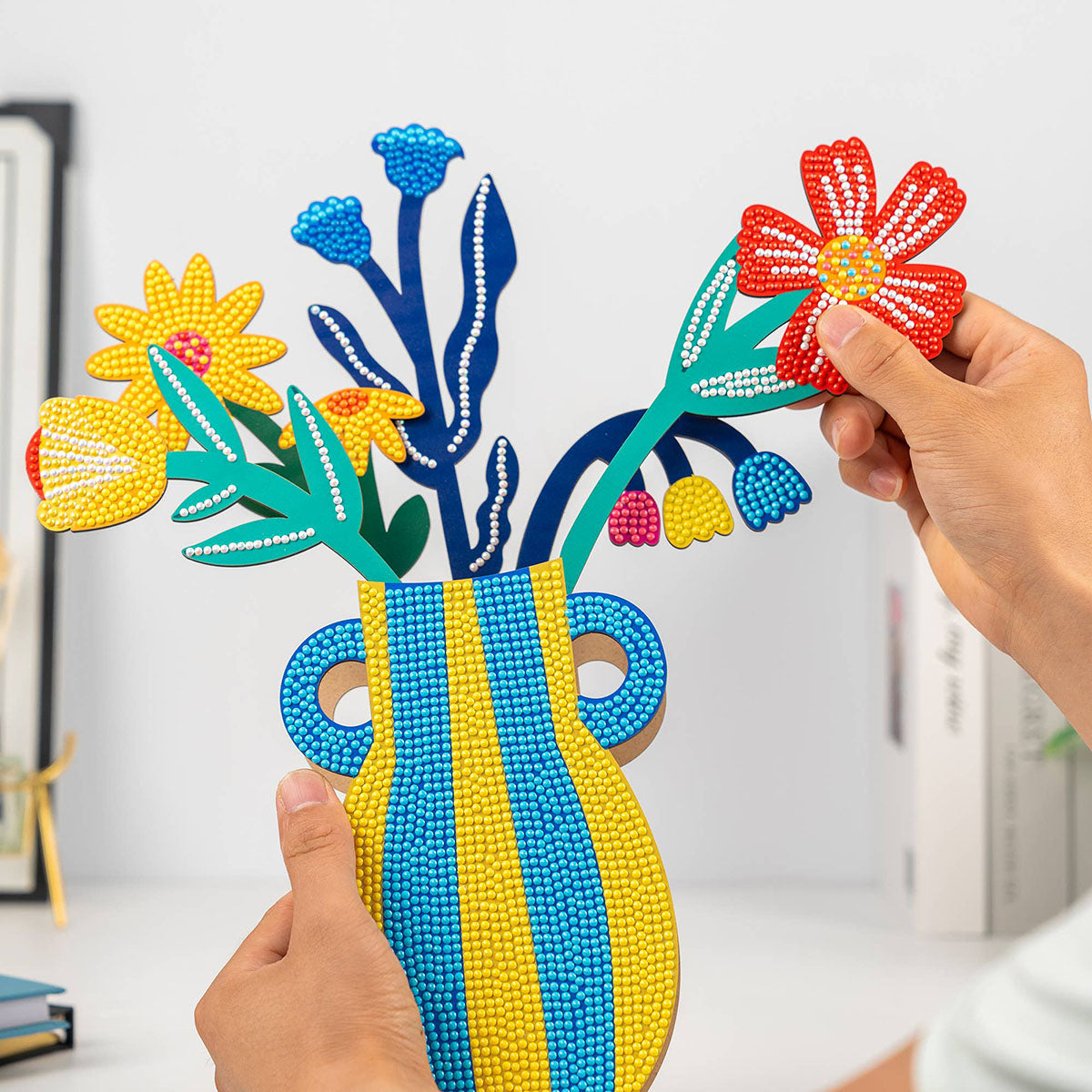 Person holding the completed Craft Hero PixelPop Capri Bloom 3D Diamond Painting Kit