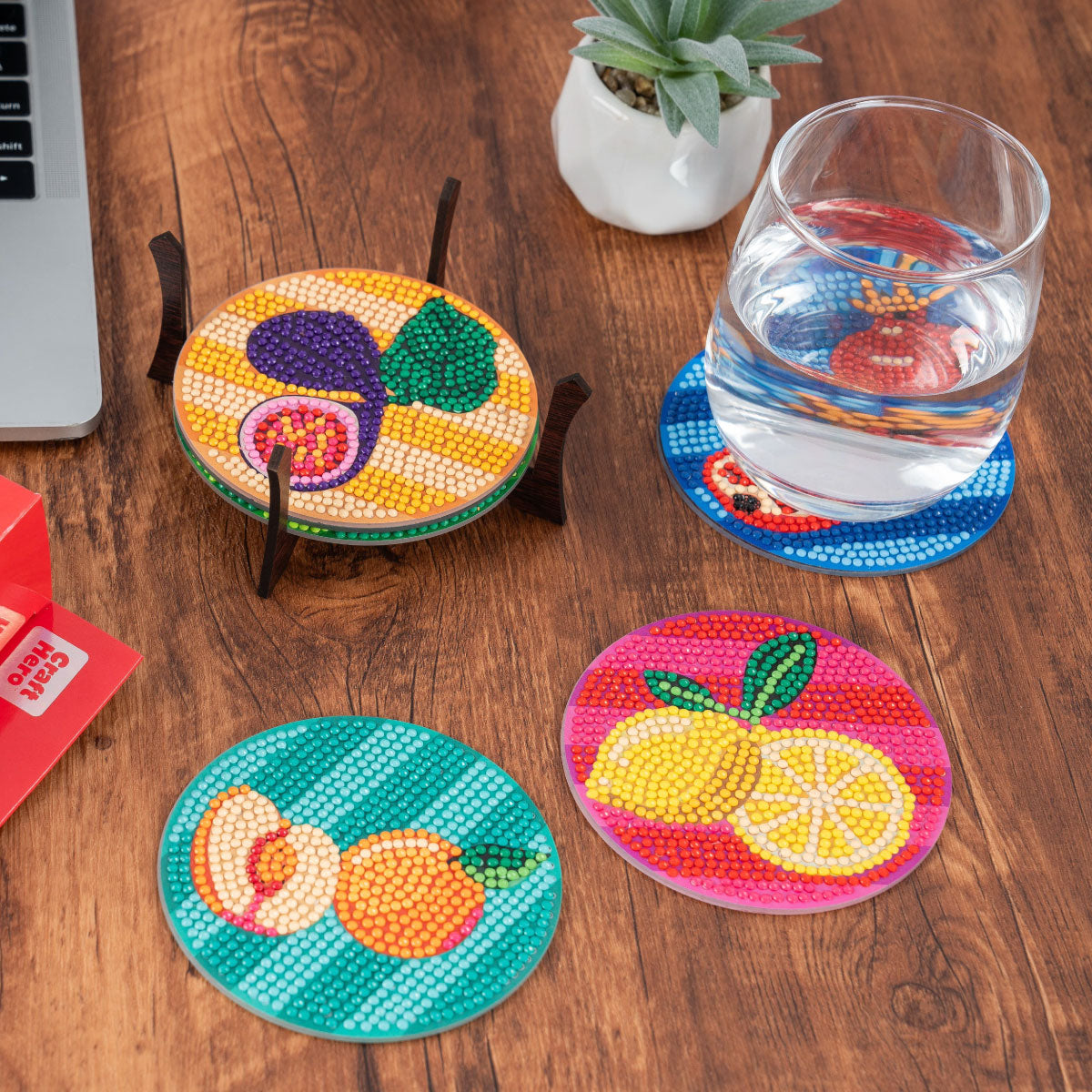Craft Hero PixelPop Tutti Frutti Coasters Diamond Painting Kit shown in use on a desk.