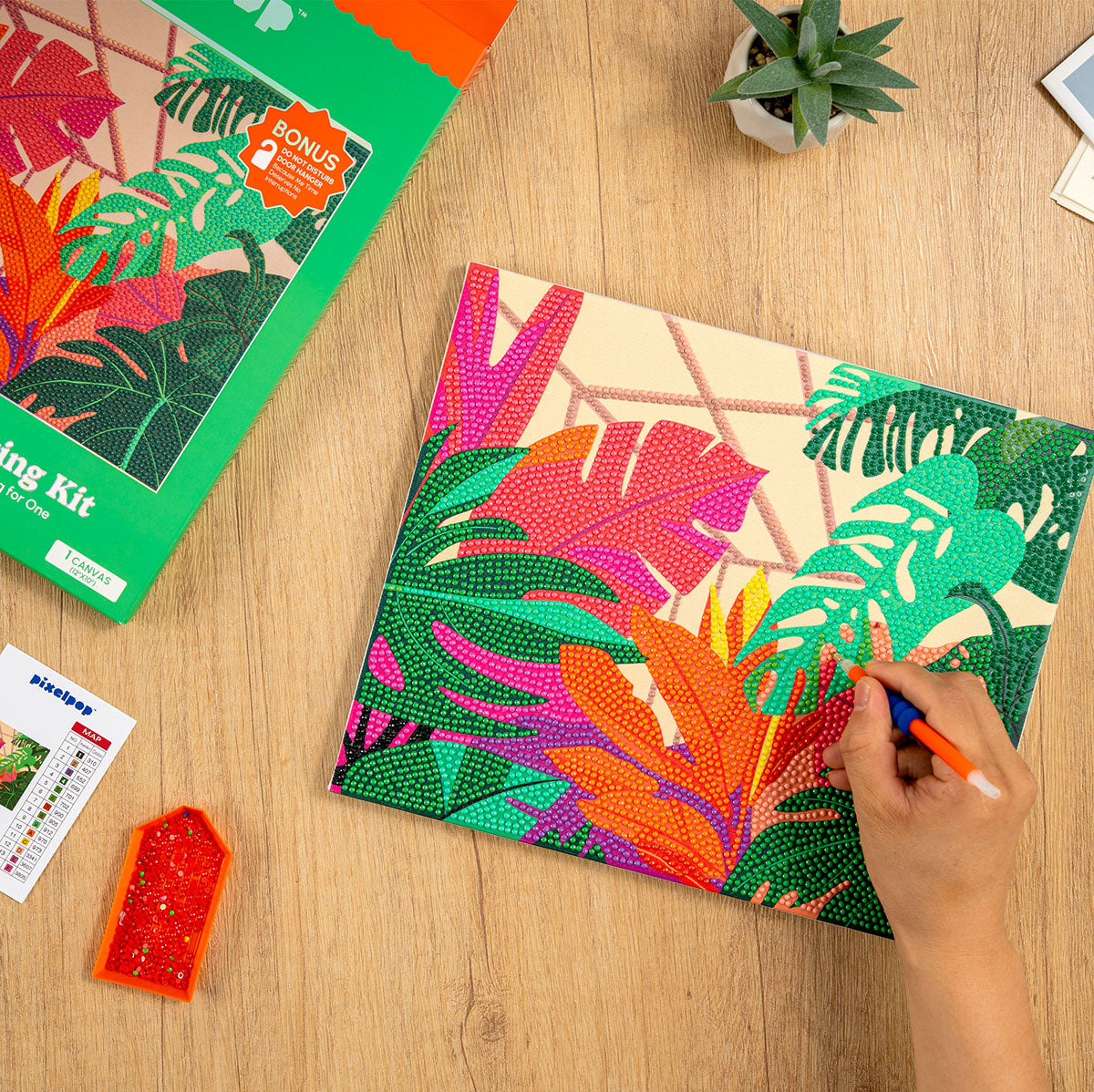 Person using the Craft Hero PixelPop Orangery Diamond Painting Kit