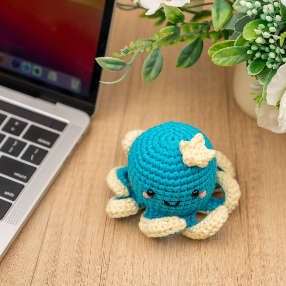 Craft Hero Threadies Ollie Octopus Crochet Kit completed project shown sitting on a desk