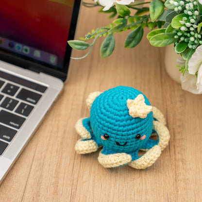 Craft Hero Threadies Ollie Octopus Crochet Kit completed project shown sitting on a desk