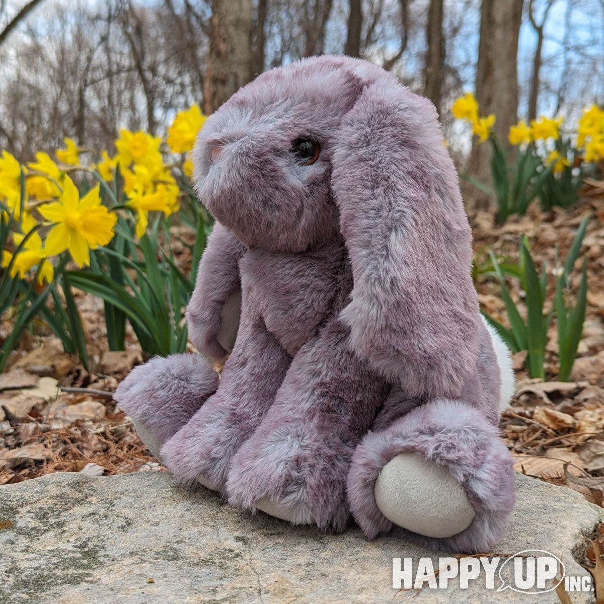 Douglas Softs Vickie the Purple Bunny loves daffodils