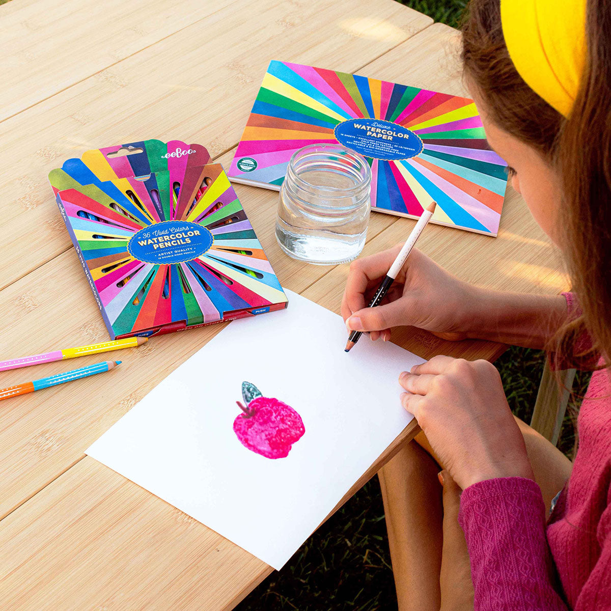 Person drawing with eeBoo watercolor pencils on eeBoo Deluxe Watercolor Paper.