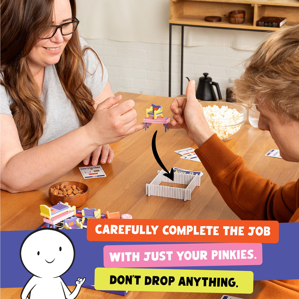 Giants Moving Tiny Furniture Party Game from Exploding Kittens