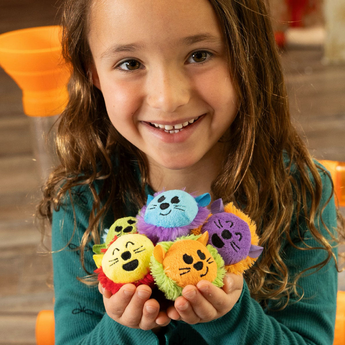 Child holding all five Air Toobz Toobzters 