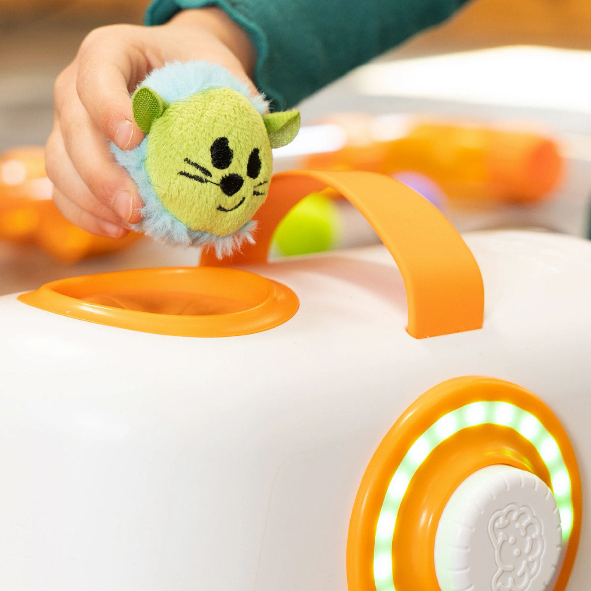 Child placing a Toobzter in the Air Toobz fan unit.