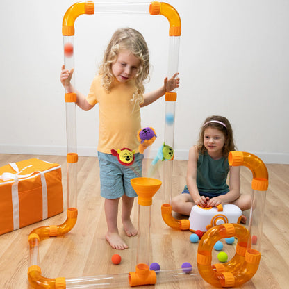 Children playing with the Air Toobz Toobzters and the original Air Toobz set.