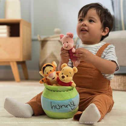 Gund Disney Winnie the Pooh Plush Playset with Pooh Bear, Piglet, and Tigger.