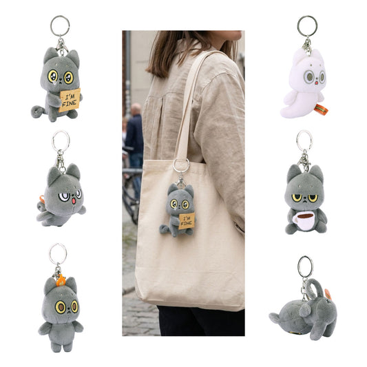 A collage showing a gray Hakongee cat character keychain in multiple poses, including one worn on a beige tote bag by a person in an outdoor street setting. The keychain has a round metal ring.