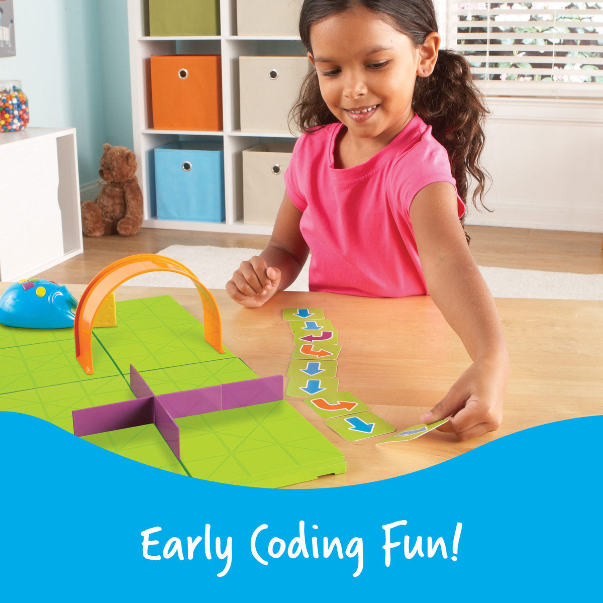 Child playing with the Learning Resources Code & Go Robot Mouse STEM activity set