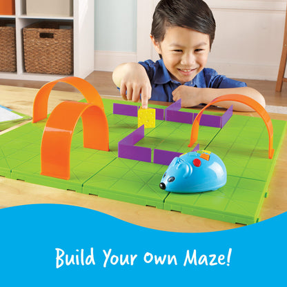 Child playing with Learning Resources Code & Go Robot Mouse STEM activity set