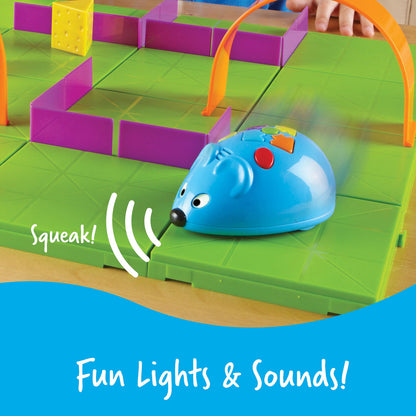 Learning Resources Code & Go Robot Mouse STEM activity set mouse with lights and sounds on a green track with colorful barriers
