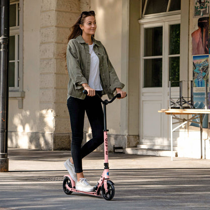 Micro Kickboard Speed Deluxe Scooter with adult woman riding.