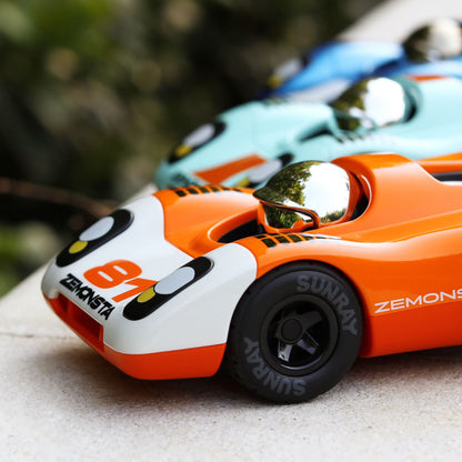 Playforever Zemonsta Race Cars are Egon (orange and white), Klaus (mint blue and orange), and Hans (blue and white)