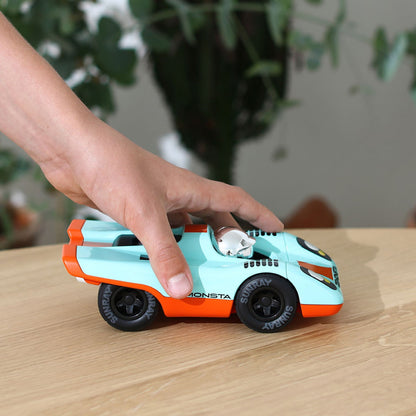 Playforever Zemonsta Race Car Klaus with an adult's hand for size reference.