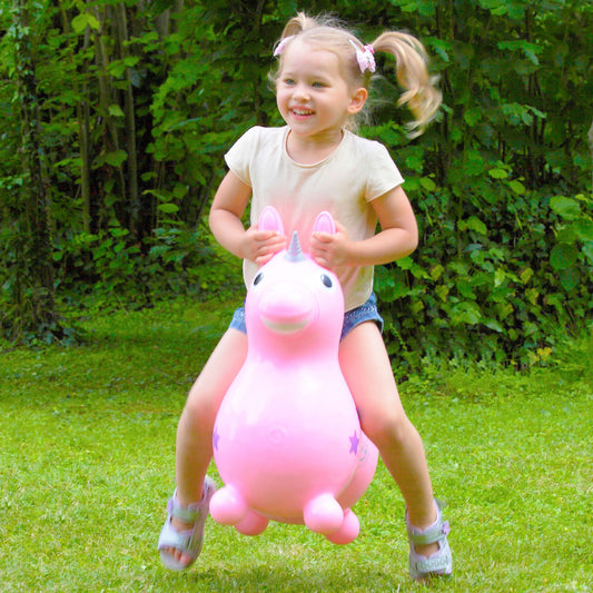 Child riding a Pink Rody Magical Unicorn from Gymnic 