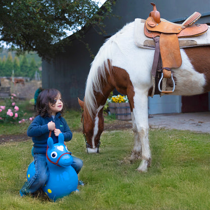 Child on a Rody inflatable horse with the Saddle & Bridle accessory