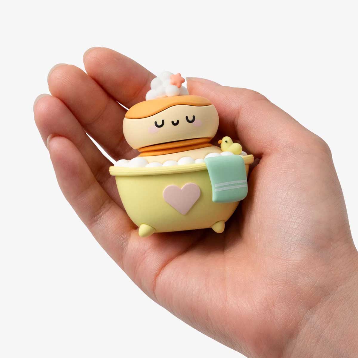Single Smoko Friends Bathroom Blind Box Figure sitting in palm of hand