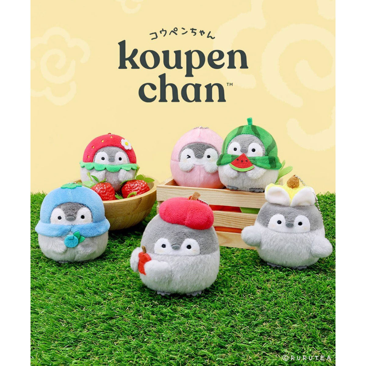 Six Koupen Chan plush toys styled on artificial grass with a wooden crate, set against a pale yellow background with the Koupen Chan logo and Japanese text.