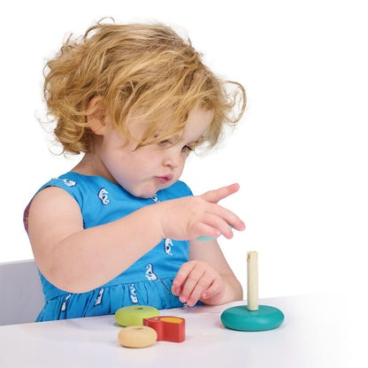 Wooden, cute and colorful stacking toy with four donut-shaped rings of different sizes and a cute bird perched on top, from Mentari.