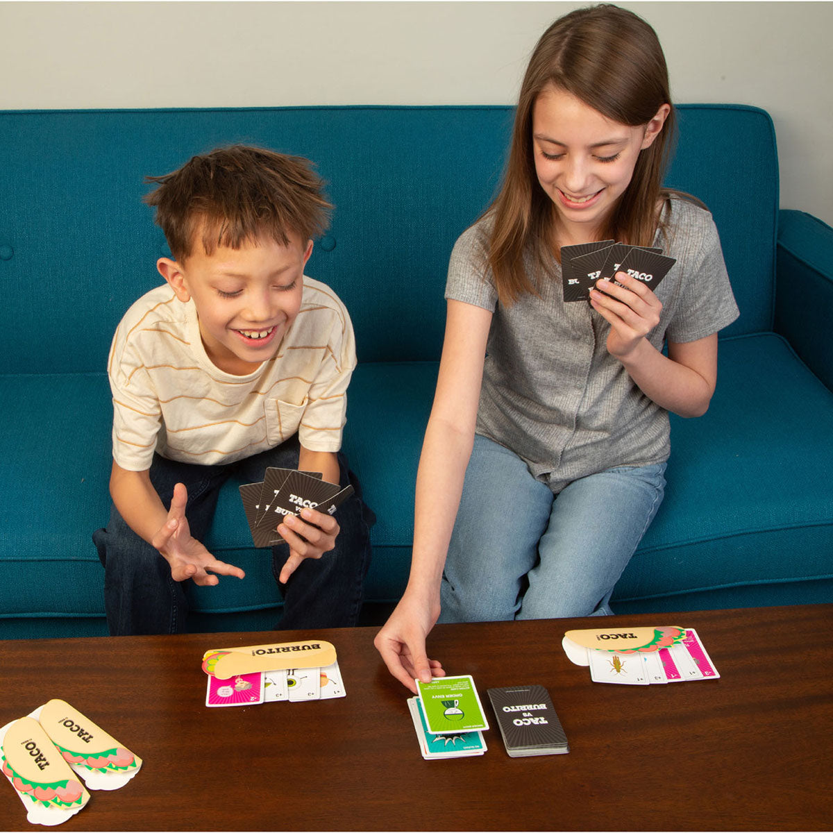 Kids playing Taco vs Burrito Card Game