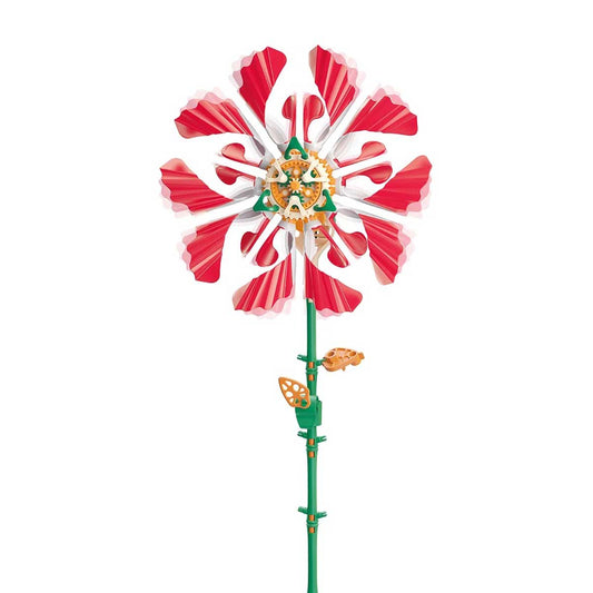 Completed red mechanical flower cutout on white background. Thames and Kosmos SolarFlower Ruby Ripple