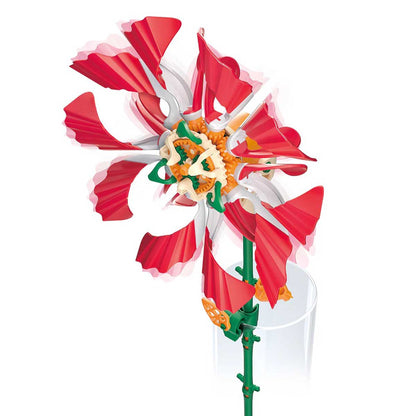 Completed red mechanical flower cut out on white background. Thames and Kosmos SolarFlower Ruby Ripple