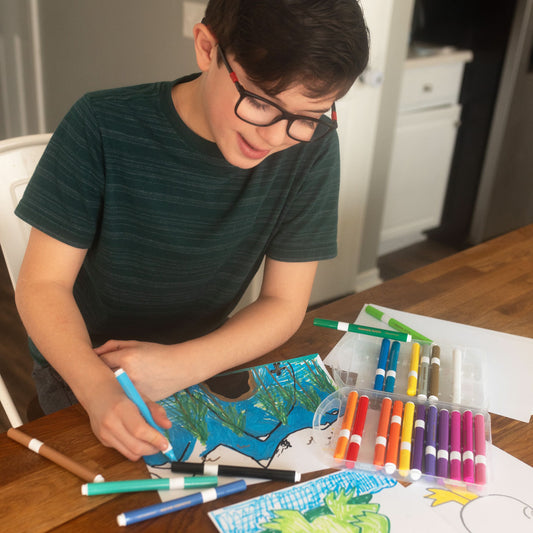 The Pencil Grip Co Magic Stix Washable Acrylic Markers Child coloring with markers at a table
