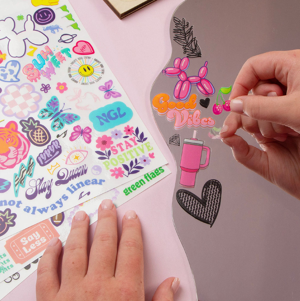 Tween adding decorations to the Very Marie Affirmation Mirror