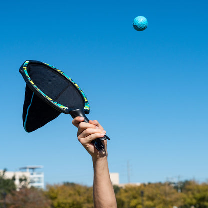 Waboba SlingAir Slingshot Catch Game - snag the ball from the air with the racket, or let it drop in. Then launch it back to your partner!