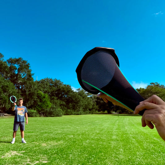 Waboba SlingAir Slingshot Catch Game - Pull back the ball in the racket's net to launch.