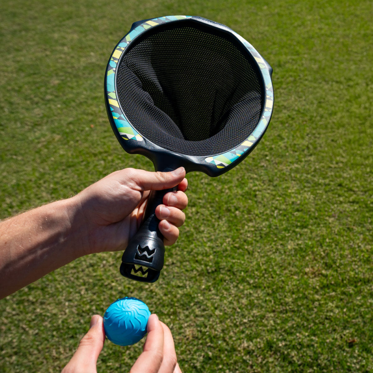 Waboba SlingAir Slingshot Catch Game - ball storage in the handle of the racket makes this an easy grab and go game!
