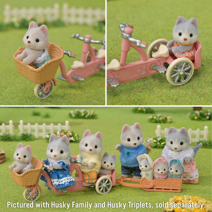 Calico Critters Tandem Cycling Set pictured with Husky Family and Husky Triplets, sold separately.